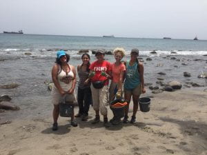The Archaeology team with our beautiful every day view picking up our tools after our last day of digging: Gabriela, Alexis, Kaylee, Gelenia and Gabby (left to right). (Photo by Melissa Romero McCarthy 2018)